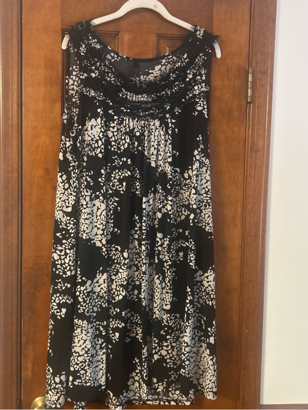 Sleeveless Black and White Midi Dress with Ruffled Yoke
